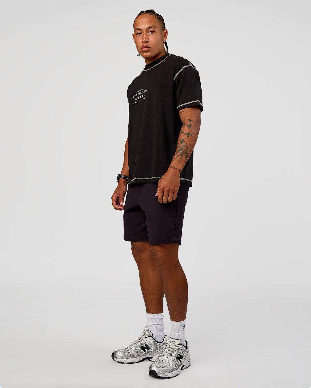 Man wearing CF Unisex Oversized Heavyweight FLXCotton Tee - Black-CF Move Through It | Model:Malebo | Size:M - view 5