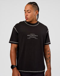 Man wearing CF Unisex Oversized Heavyweight FLXCotton Tee - Black-CF Move Through It | Model:Malebo | Size:M | Thumbnail Index: 5