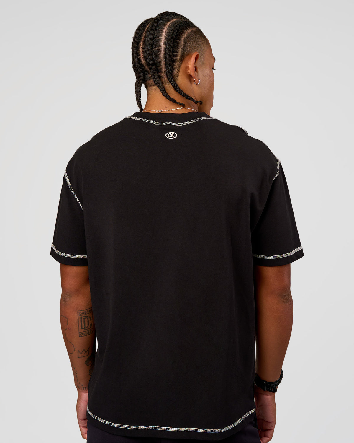 Man wearing CF Unisex Oversized Heavyweight FLXCotton Tee - Black-CF Move Through It | Model:Malebo | Size:M