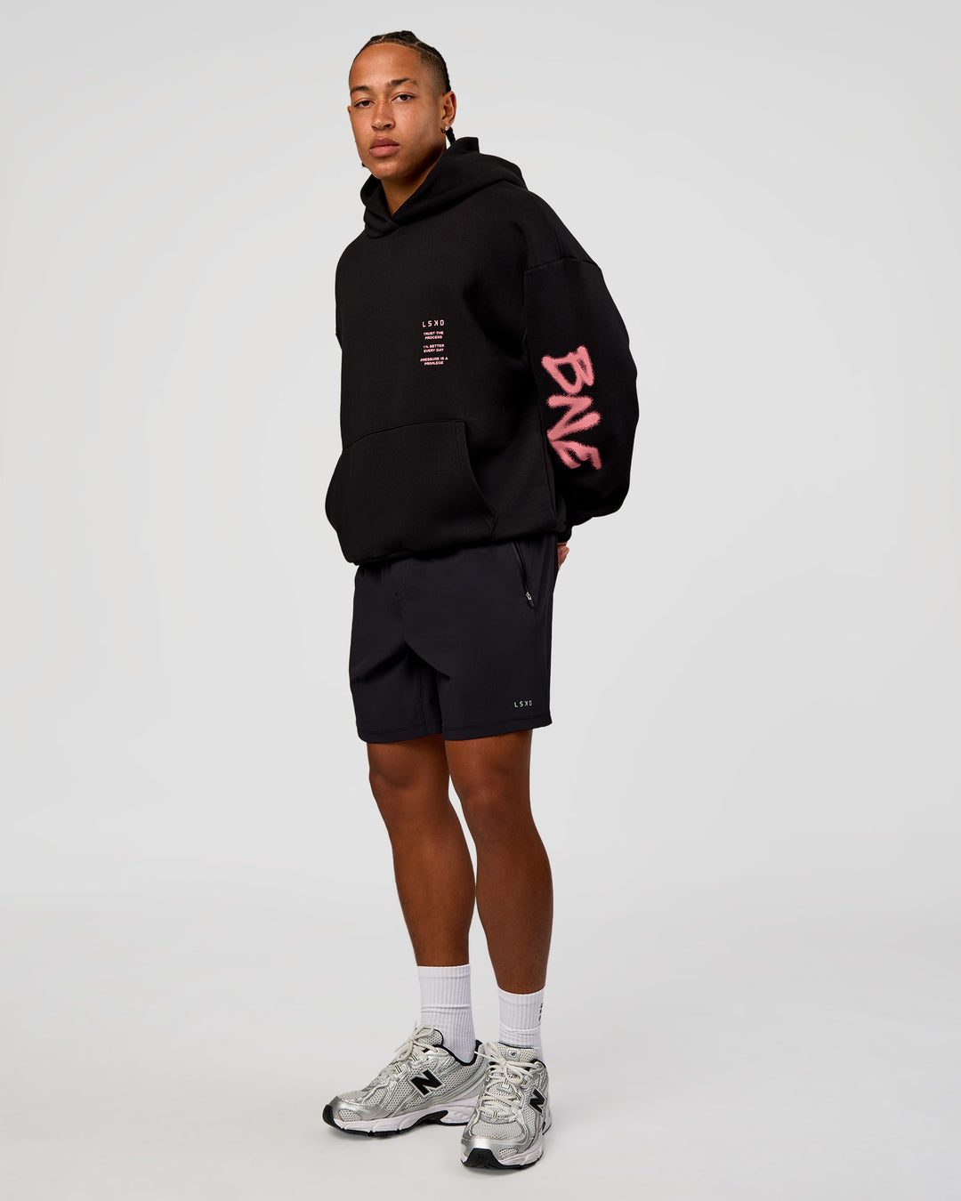 Man wearing CFT BNE 26 Unisex Oversized Hoodie - Black-Candy Pink | Model:Malebo | Size:M - view 5