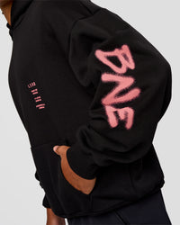 Man wearing CFT BNE 26 Unisex Oversized Hoodie - Black-Candy Pink | Model:Malebo | Size:M | Thumbnail Index: 3