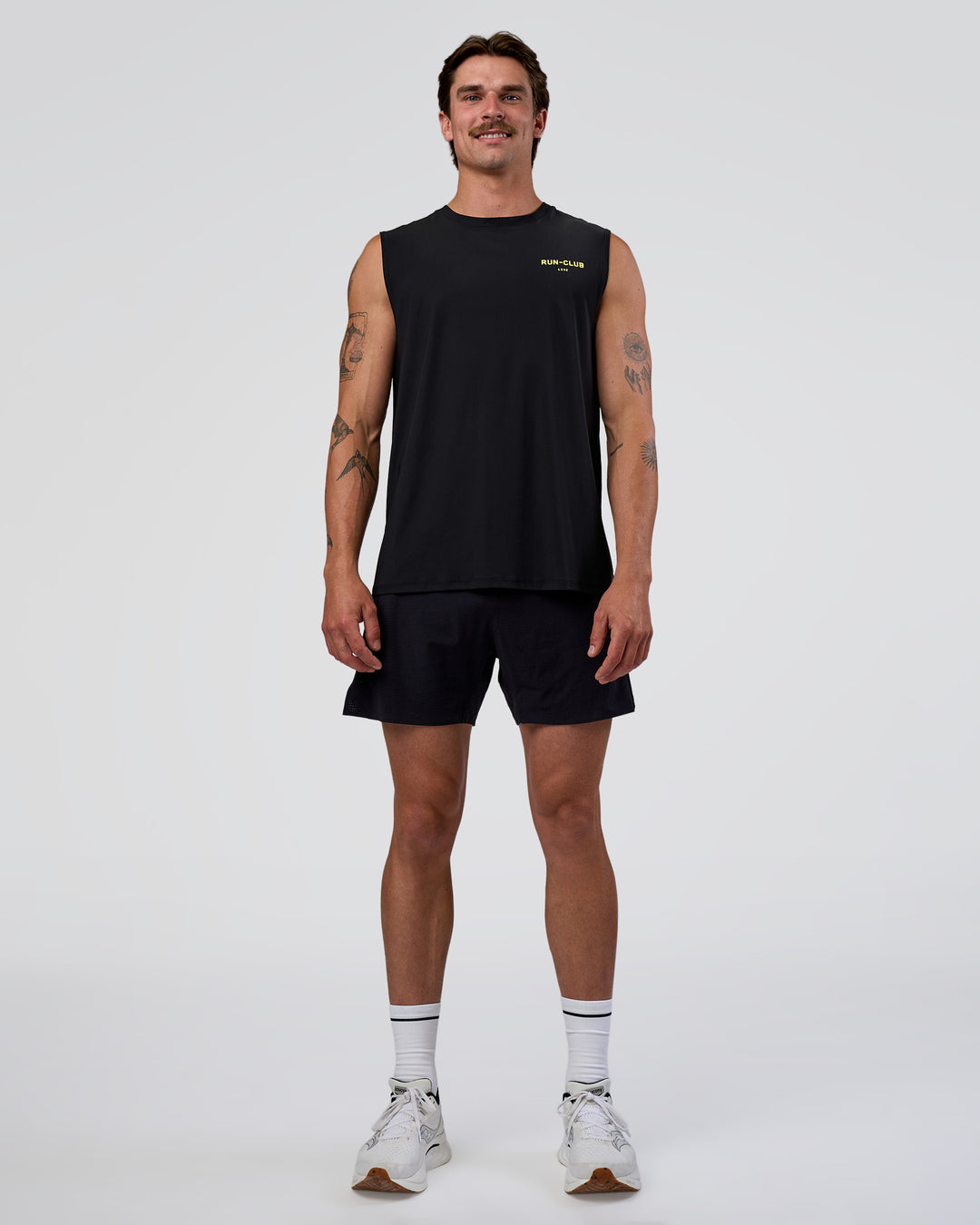 Man wearing Cadence RUN CLUB Muscle Tank - Black-Yellow Fizz | Model:Konnor | Size:M - view 6