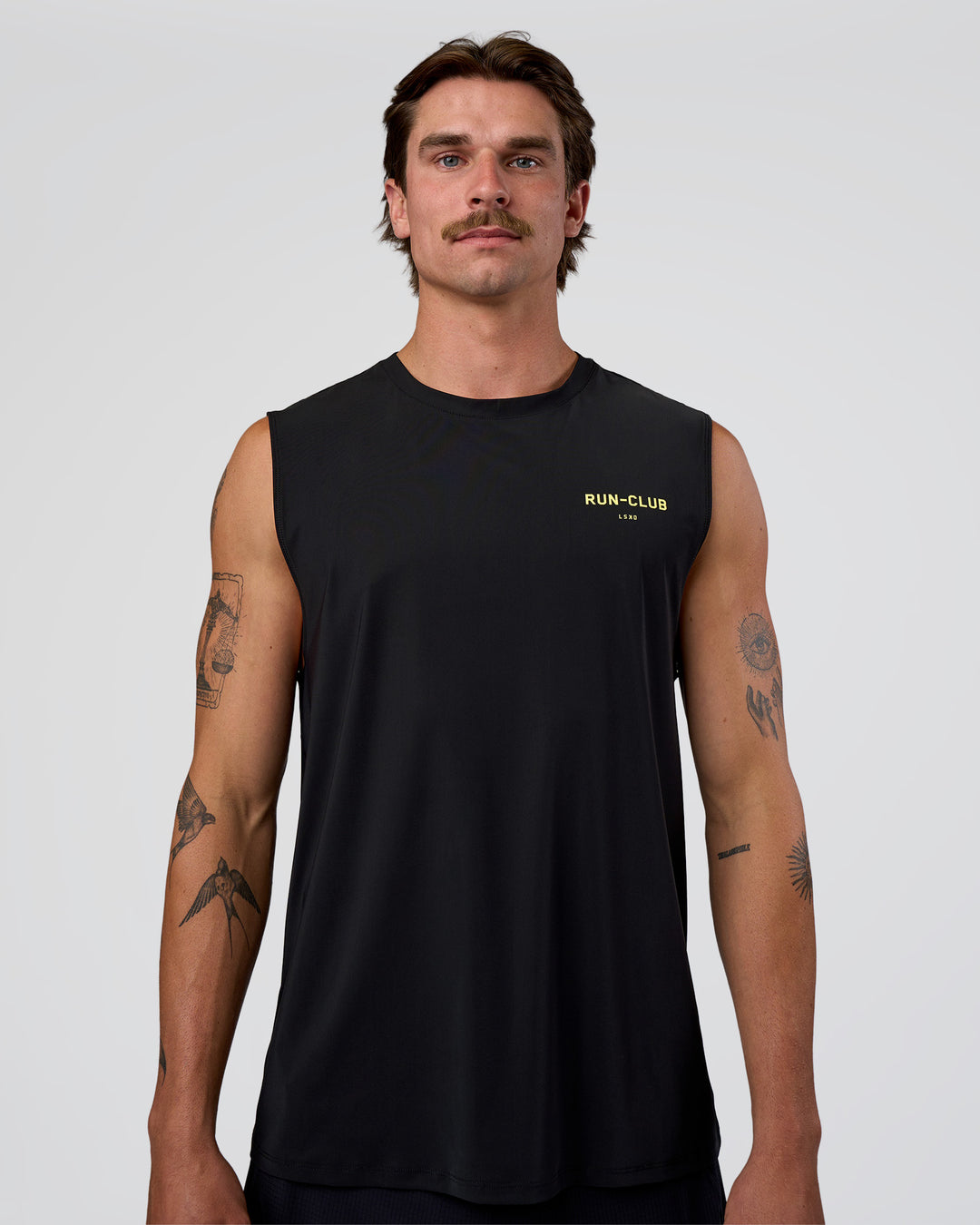 Man wearing Cadence RUN CLUB Muscle Tank - Black-Yellow Fizz | Model:Konnor | Size:M - view 3