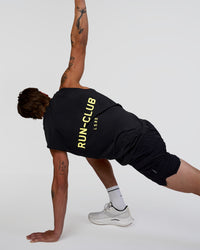 Man wearing Cadence RUN CLUB Muscle Tank - Black-Yellow Fizz | Model:Konnor | Size:M | Thumbnail Index: 4