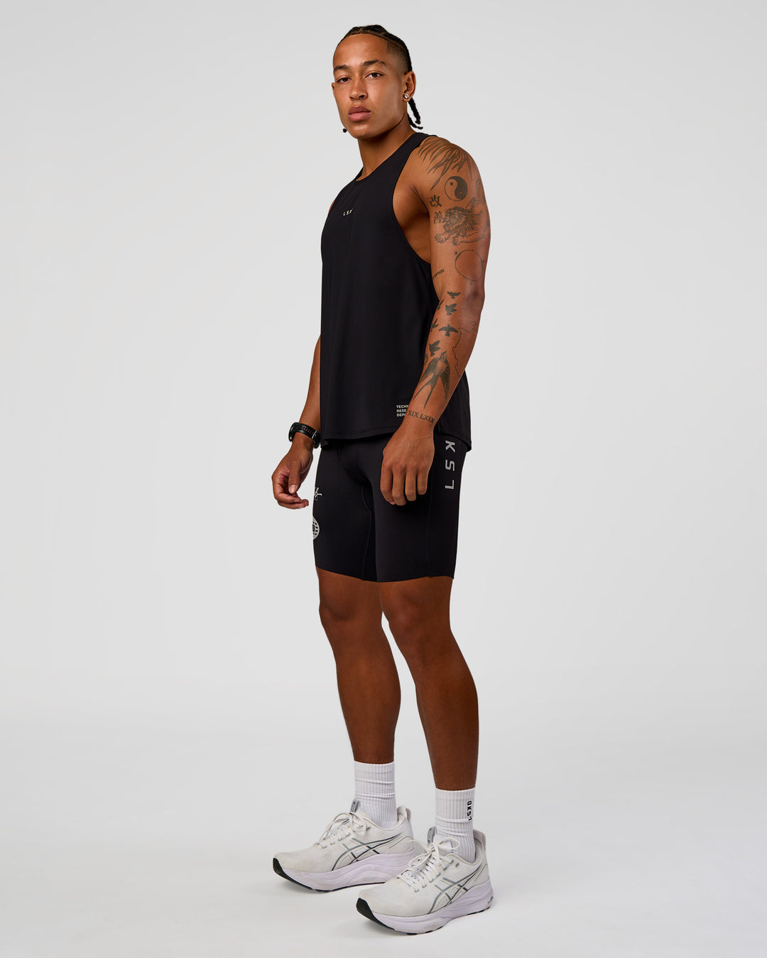 Man wearing Cadence Run Club Script Values Tank - Black-Alloy | Model:Malebo | Size:M - view 3