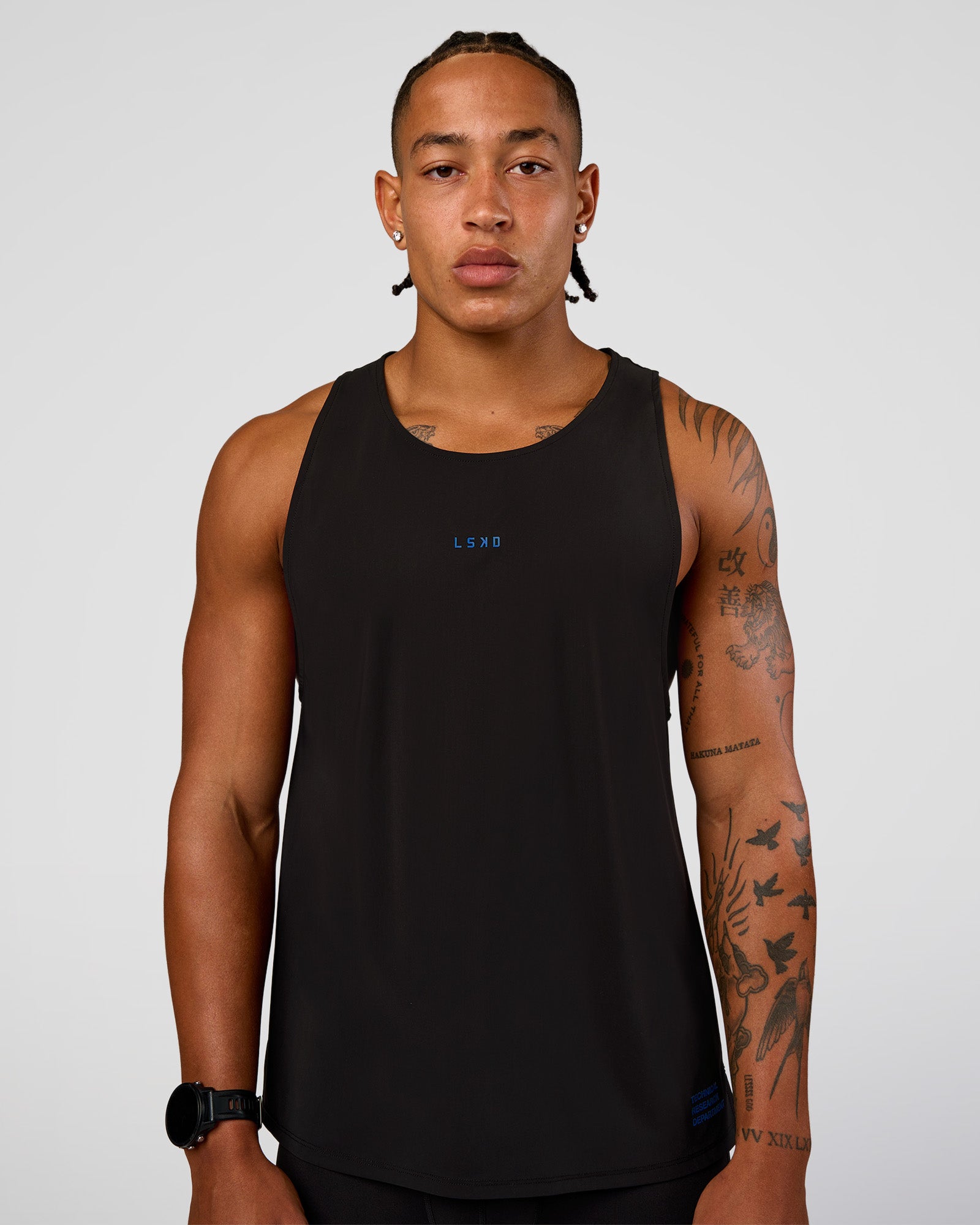Man wearing Cadence Run Club Script Values Tank - Black-Palace Blue | Model:Malebo | Size:M