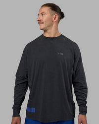 Man wearing Cali FLXCotton Oversized Long Sleeve Tee - Black Washed | Model:Jaiden | Size:M | Thumbnail Index: 2