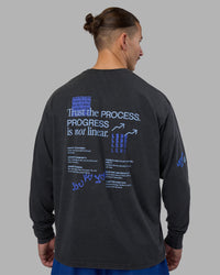 Man wearing Cali FLXCotton Oversized Long Sleeve Tee - Black Washed | Model:Jaiden | Size:M | Thumbnail Index: 1