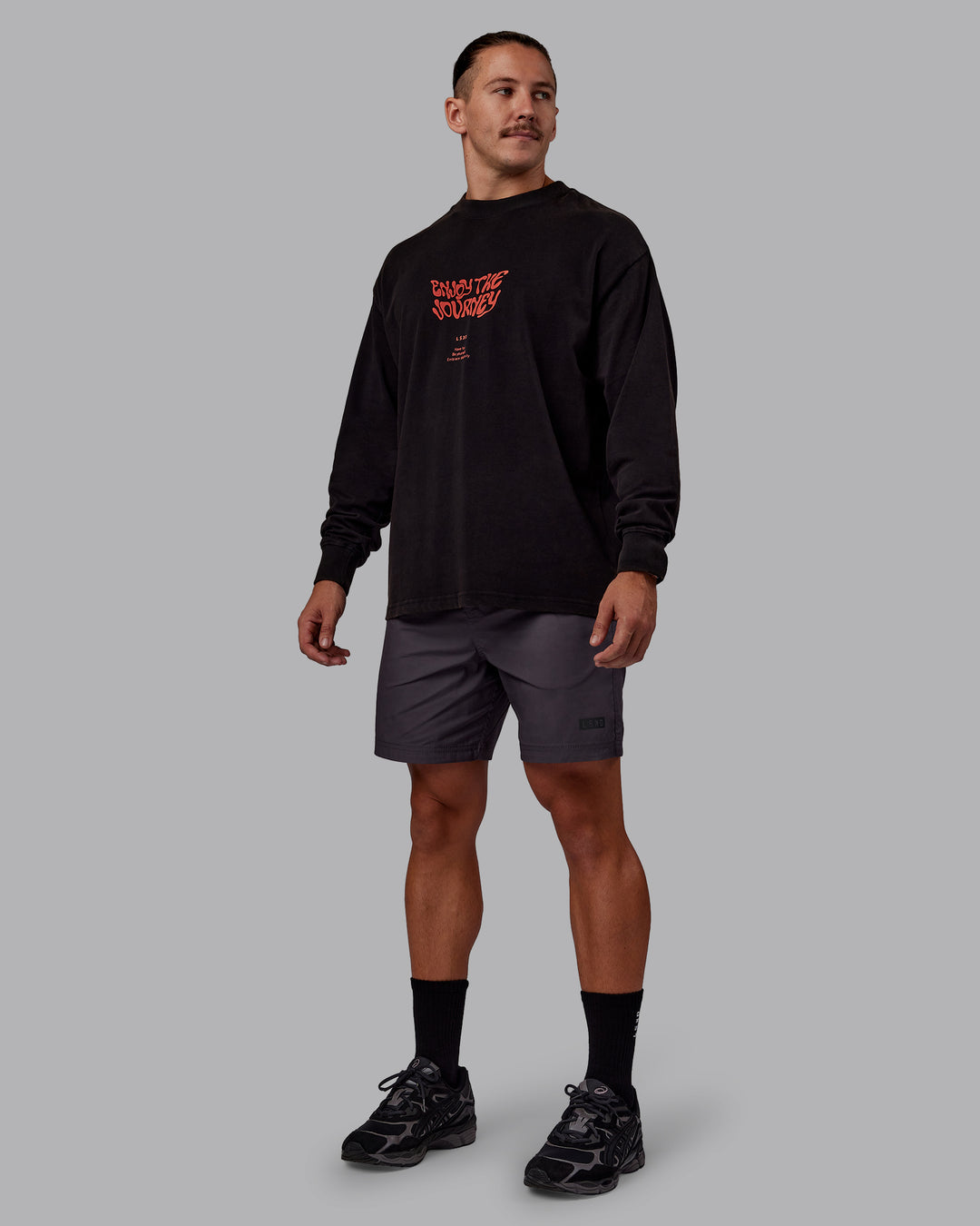 Man wearing Chrome Washed Heavyweight Oversized Long Sleeve Tee - Black-Ultra Orange | Model:Jaiden | Size:M - view 3