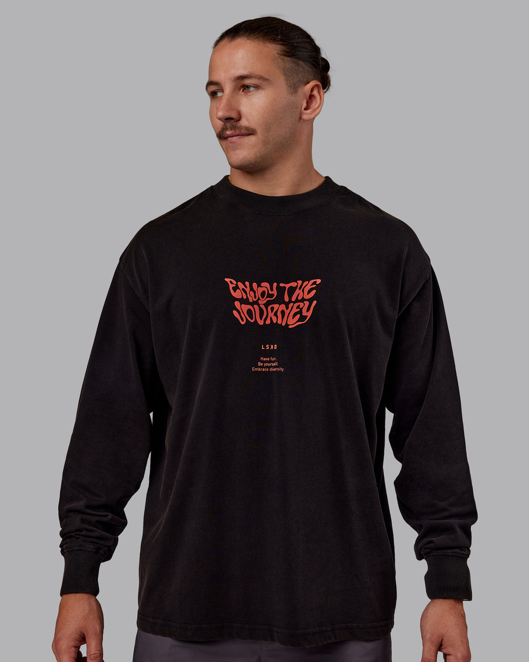 Man wearing Chrome Washed Heavyweight Oversized Long Sleeve Tee - Black-Ultra Orange | Model:Jaiden | Size:M - view 2