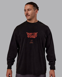 Man wearing Chrome Washed Heavyweight Oversized Long Sleeve Tee - Black-Ultra Orange | Model:Jaiden | Size:M | Thumbnail Index: 1