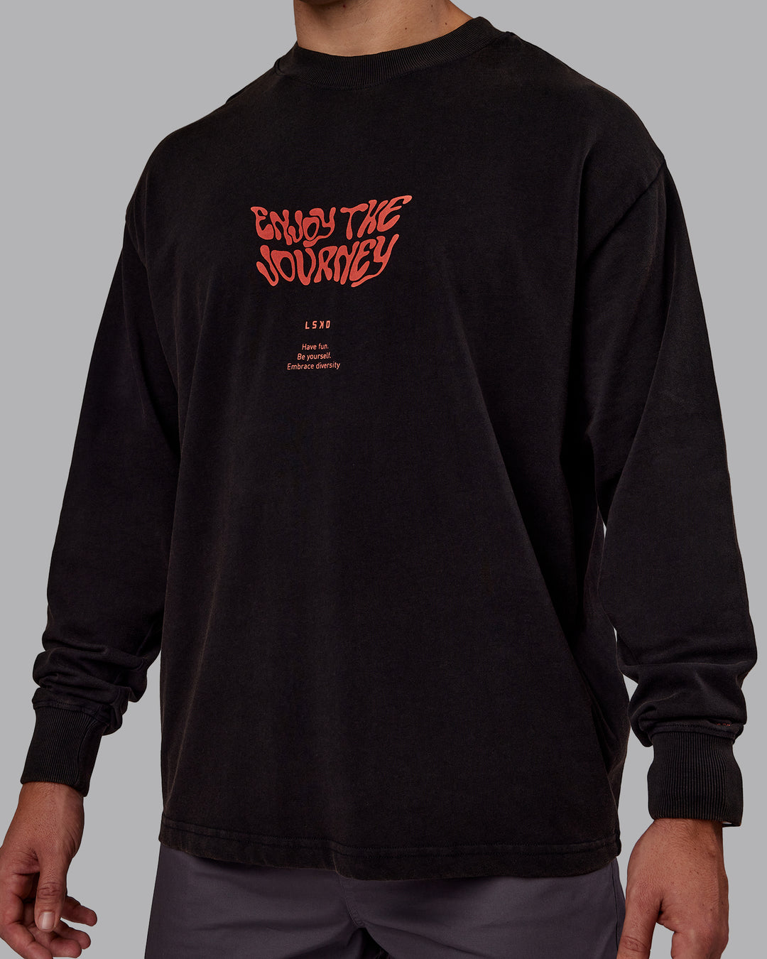 Man wearing Chrome Washed Heavyweight Oversized Long Sleeve Tee - Black-Ultra Orange | Model:Jaiden | Size:M - view 5