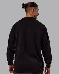 Man wearing Chrome Washed Heavyweight Oversized Long Sleeve Tee - Black-Ultra Orange | Model:Jaiden | Size:M | Thumbnail Index: 3