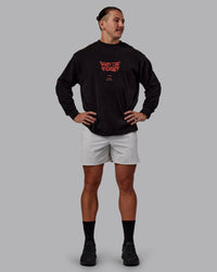 Man wearing Chrome Washed Heavyweight Oversized Long Sleeve Tee - Black-Ultra Orange | Model:Jaiden | Size:M | Thumbnail Index: 6