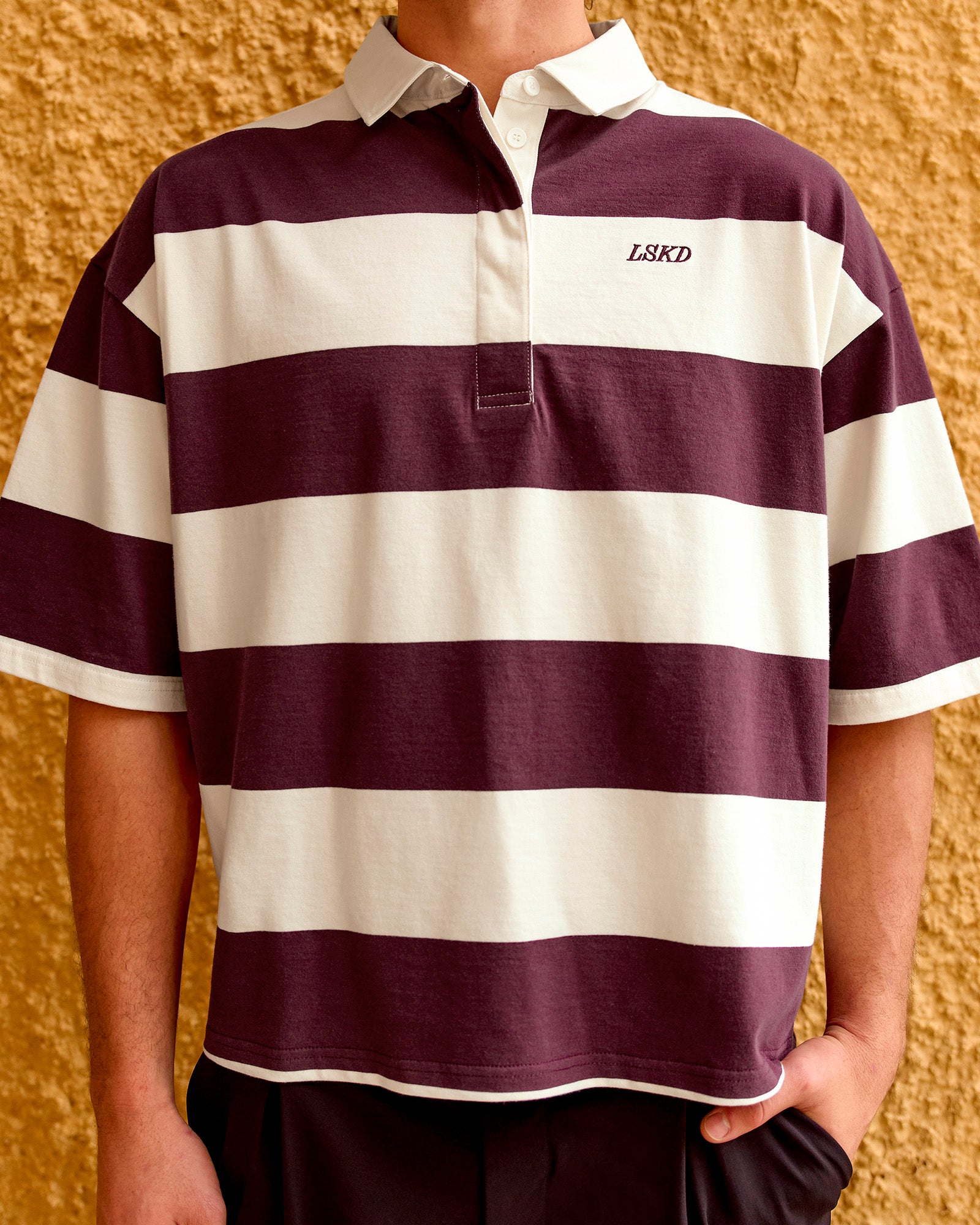 Man wearing Oversized Rugby Polo - Off White-Cherry | Model:Malebo | Size:M