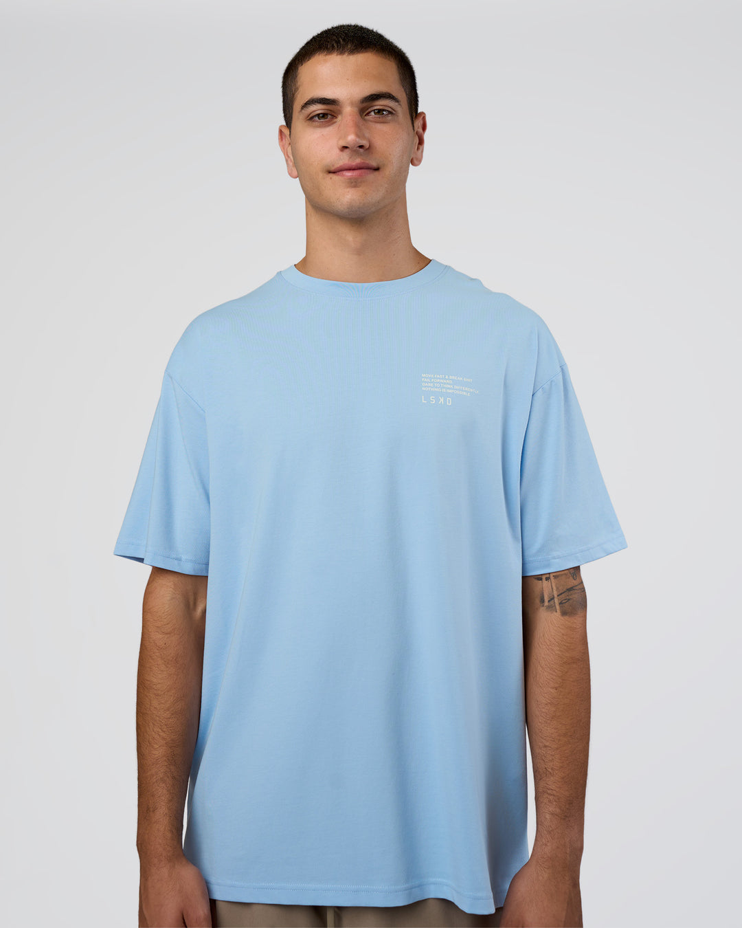 Man wearing Coffee Run FLXCotton Oversized Tee - Open Air-White | Model:Zoran | Size:L - view 2