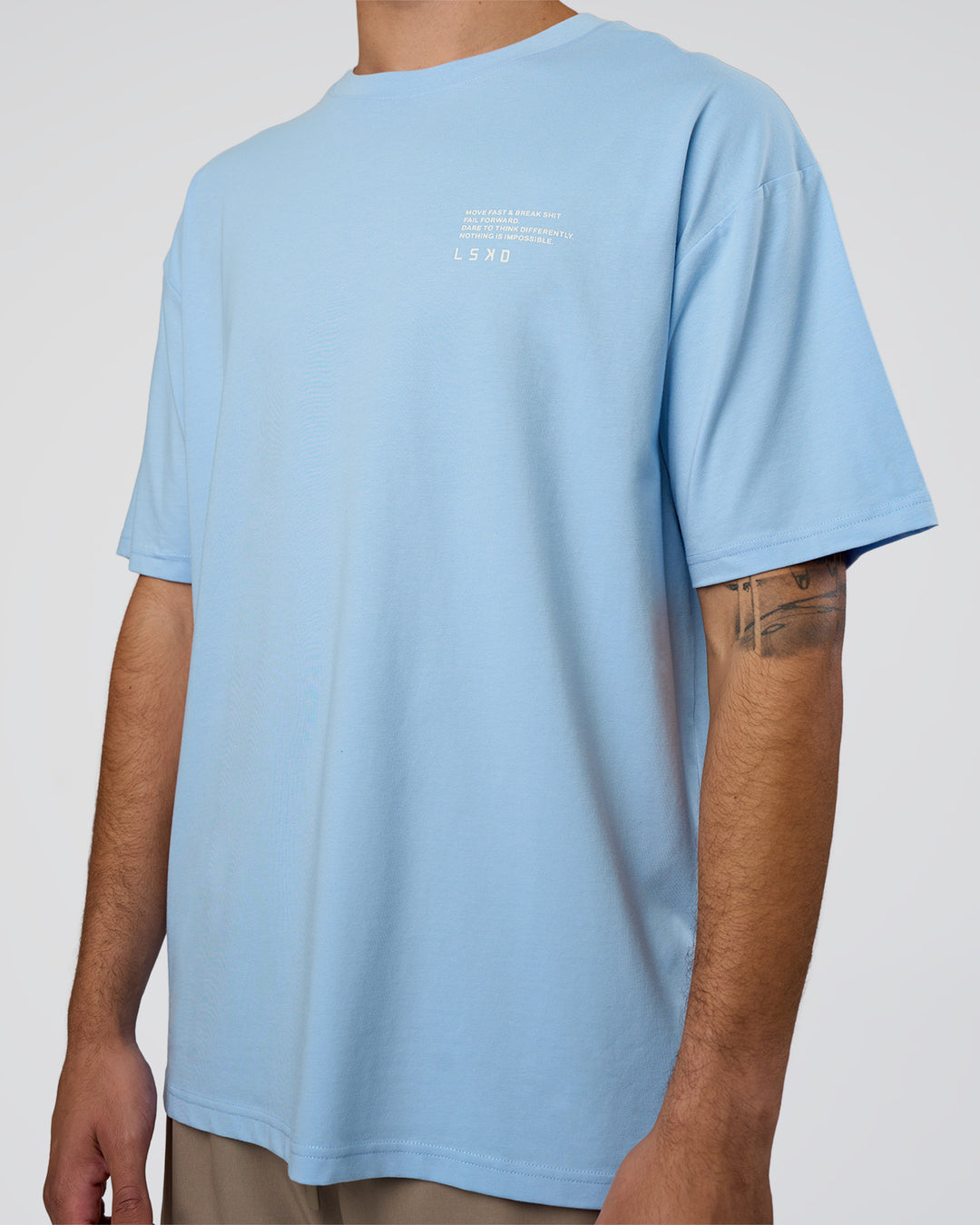 Man wearing Coffee Run FLXCotton Oversized Tee - Open Air-White | Model:Zoran | Size:L - view 7