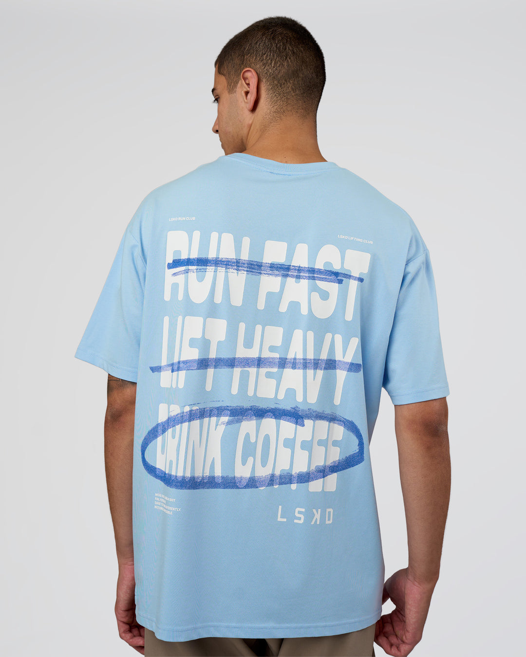 Man wearing Coffee Run FLXCotton Oversized Tee - Open Air-White | Model:Zoran | Size:L - view 1
