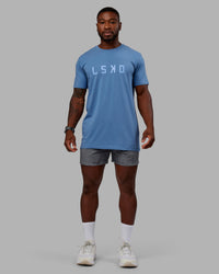 Man wearing Washed Daily 5" Shorts - Circular Grey | Thumbnail Index: 4