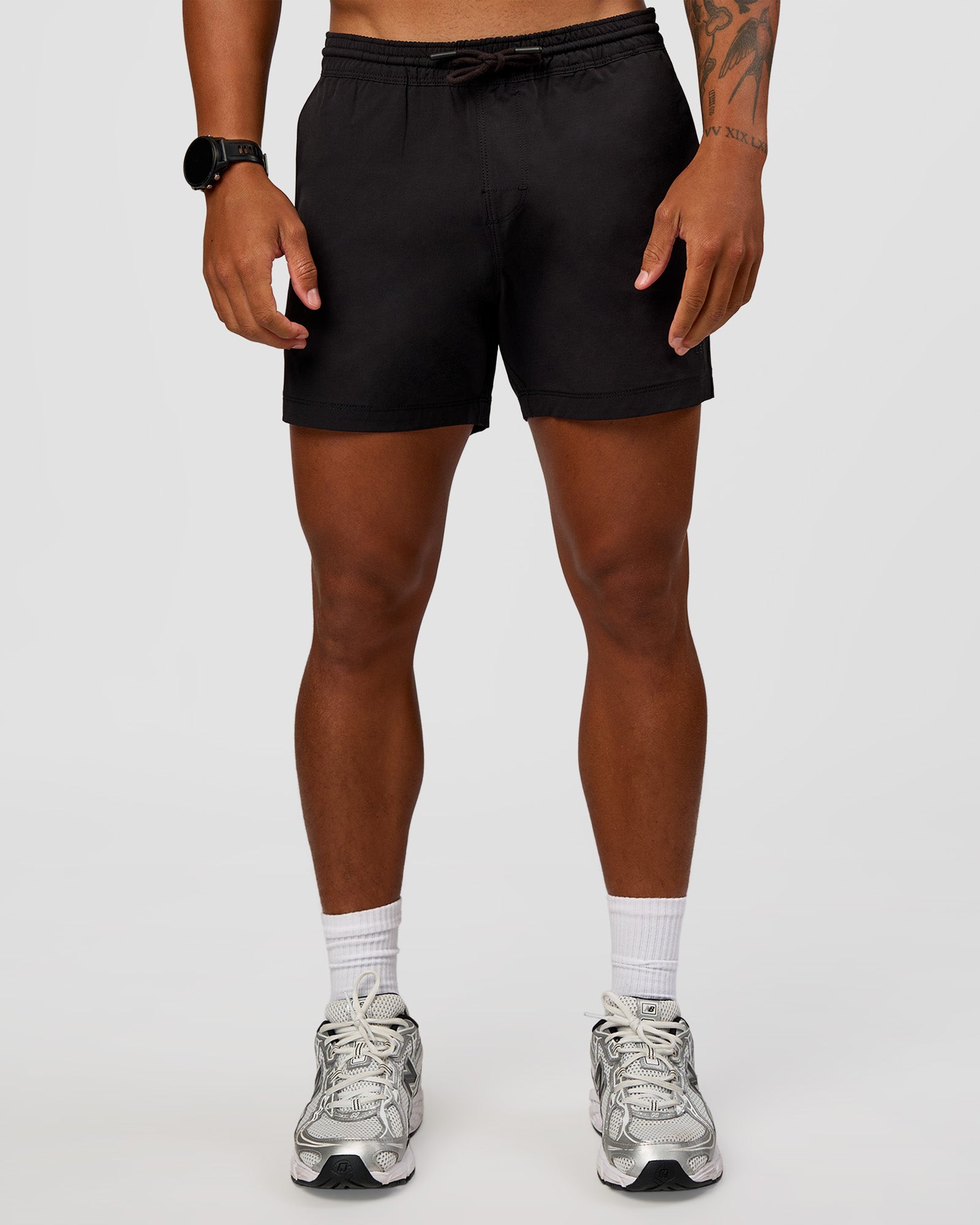 Man wearing Daily 5" Short 2.0 in Black | Model:Malebo | Size:M
