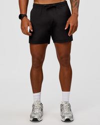 Man wearing Daily 5" Short 2.0 in Black | Model:Malebo | Size:M | Thumbnail Index: 1