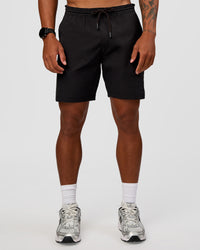 Man wearing Daily 7" Short 2.0 in  Black | Model:Malebo | Size:M | Thumbnail Index: 1