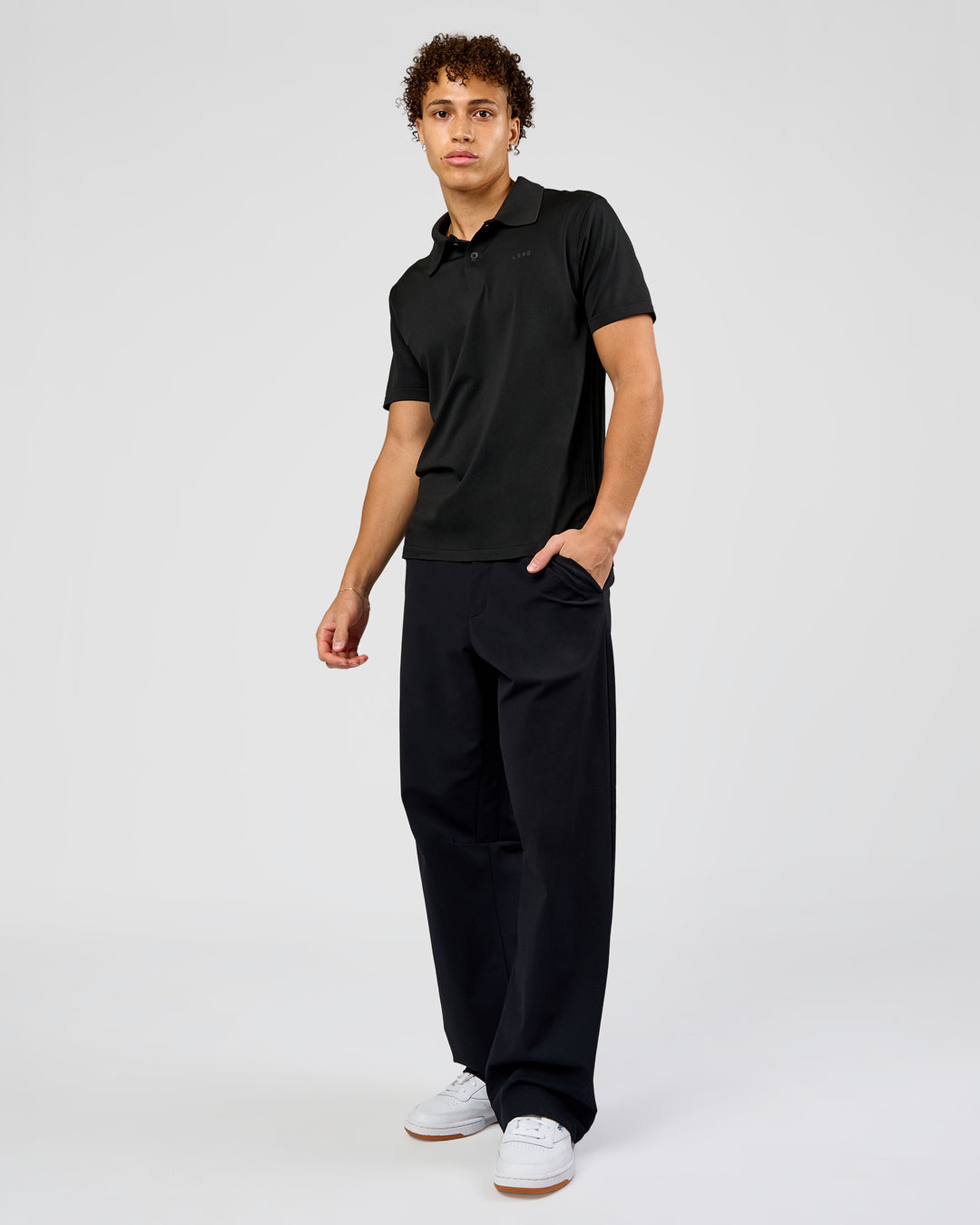 Man wearing Drive Seamless Polo - Black | Model:Leandro | Size:M - view 2