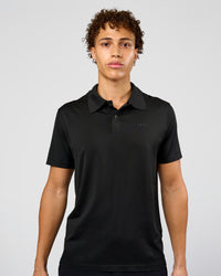 Man wearing Drive Seamless Polo - Black | Model:Leandro | Size:M | Thumbnail Index: 0