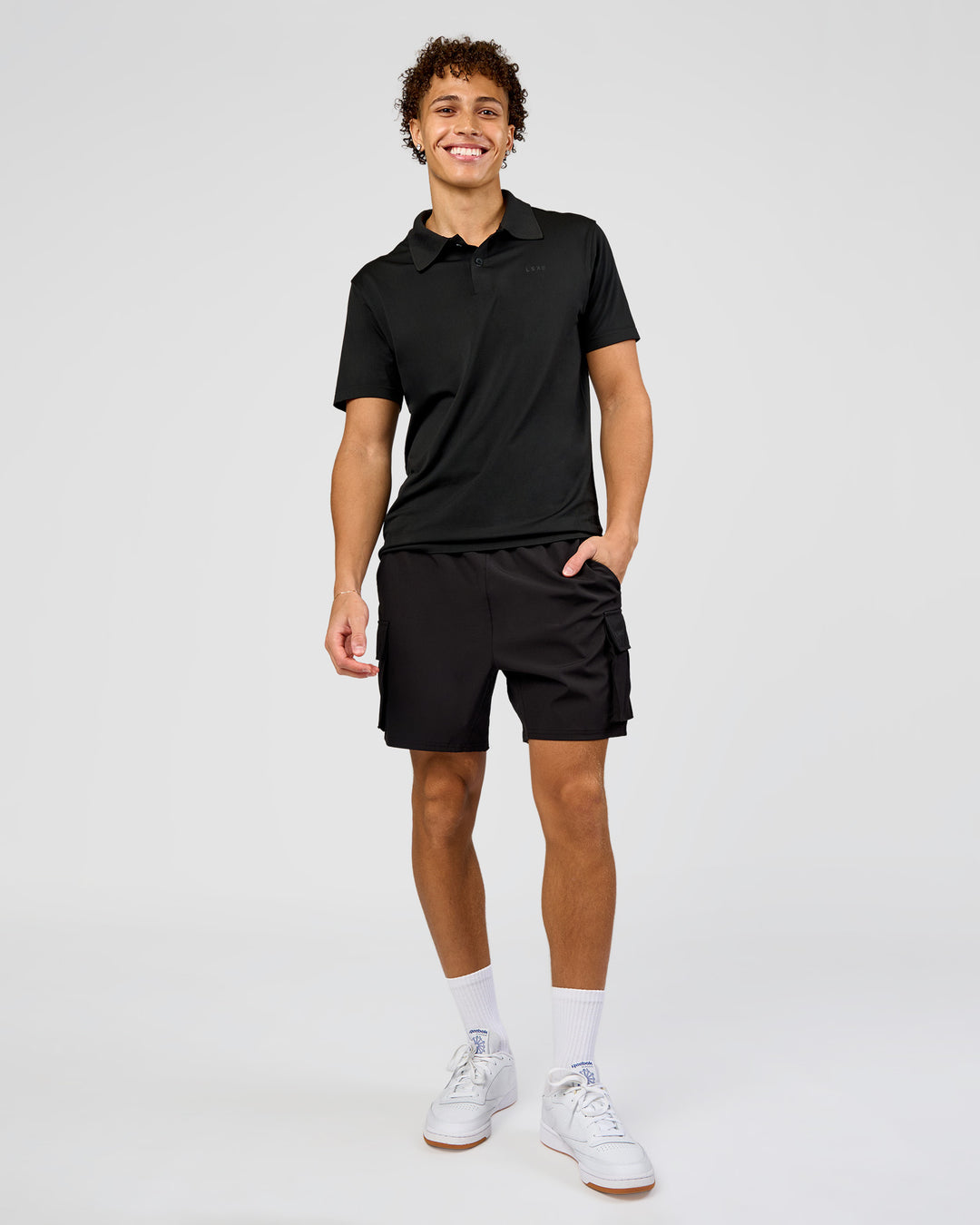 Man wearing Drive Seamless Polo - Black | Model:Leandro | Size:M - view 3