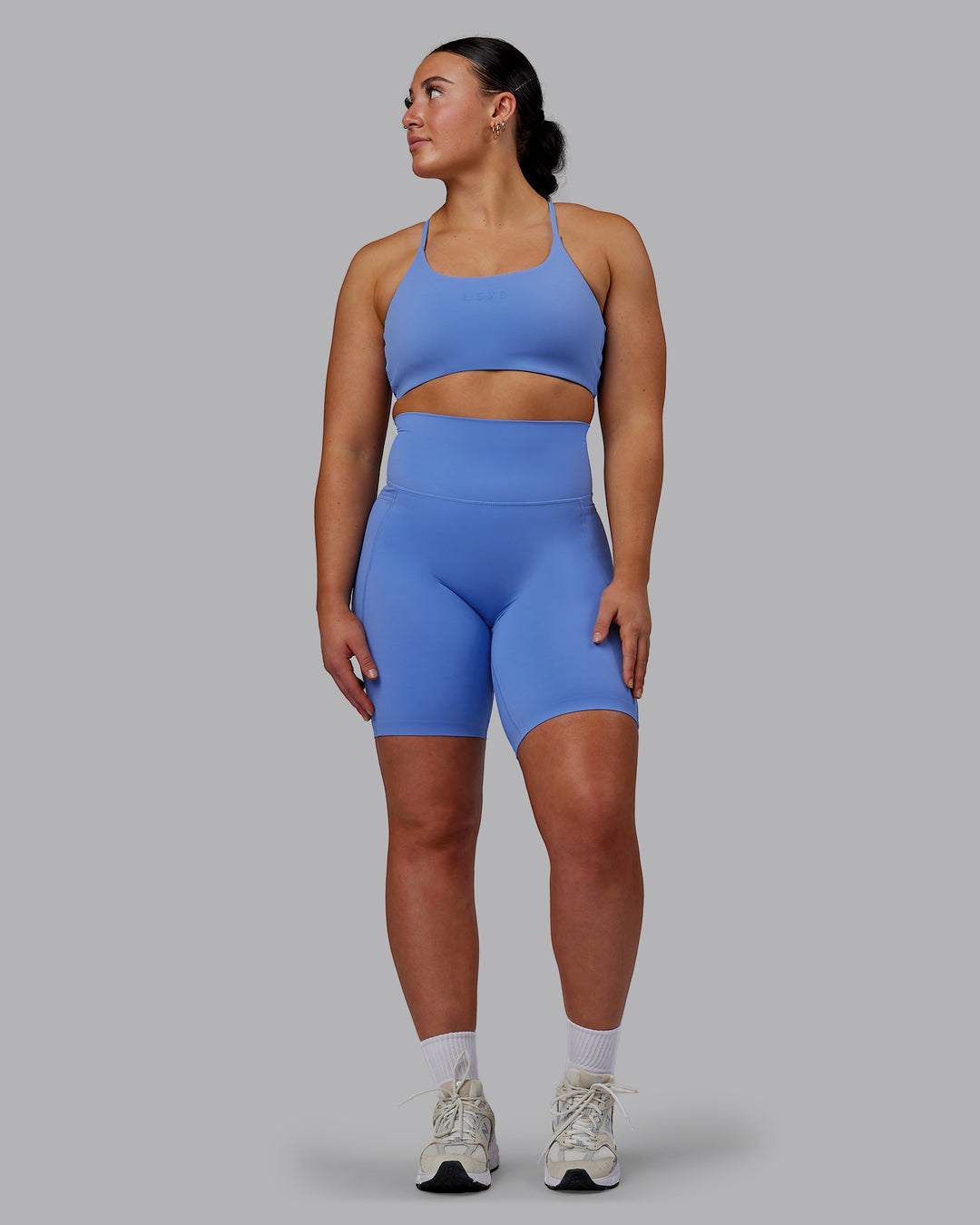 Woman wearing Elixir Ultra High-Rise 9" Short Pockets - Ultramarine | Model:Bronty | Size:M - view 1