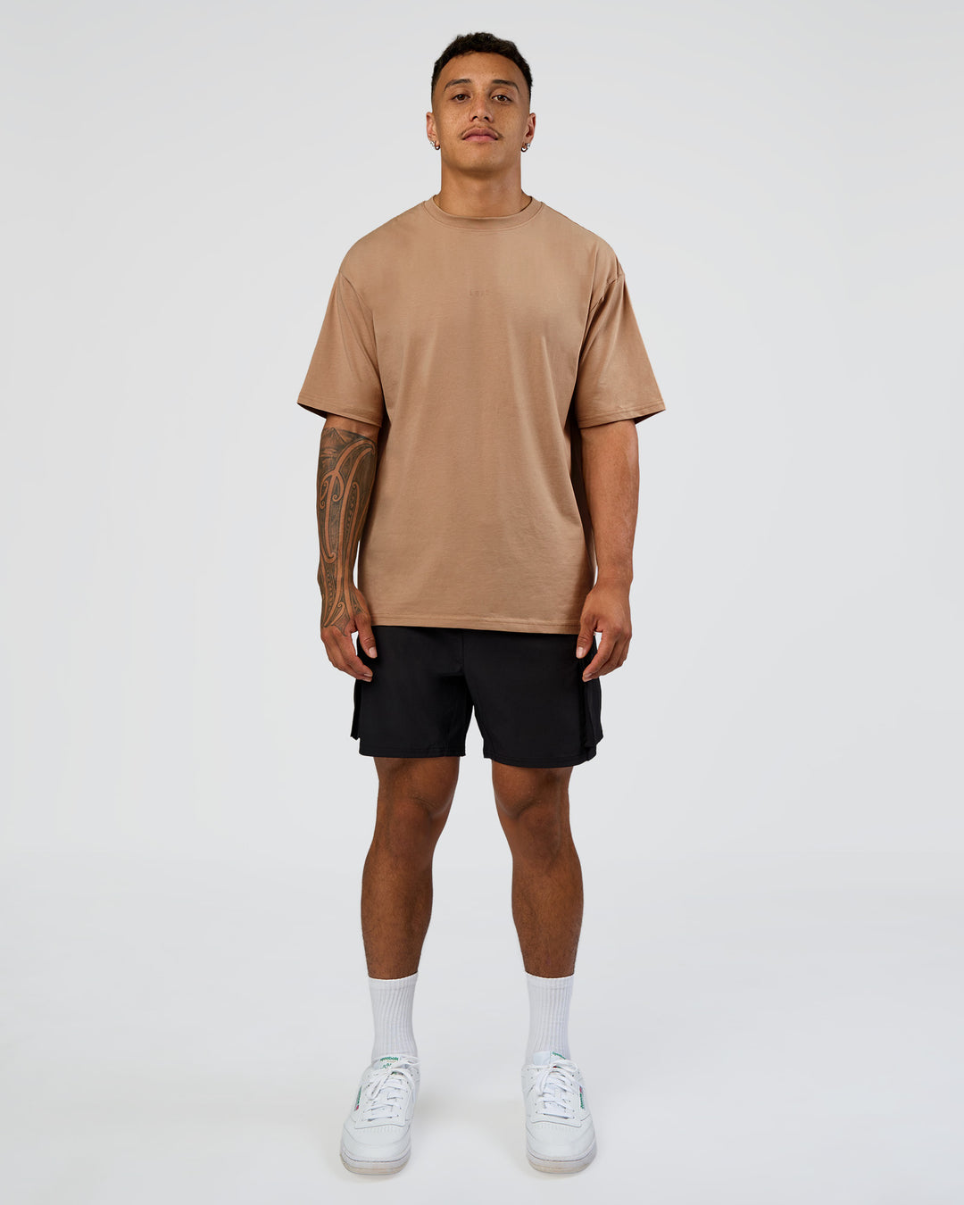 Man wearing Energy Stretch 6" Performance Cargo Short - Black | Model:Daarian | Size:M - view 3
