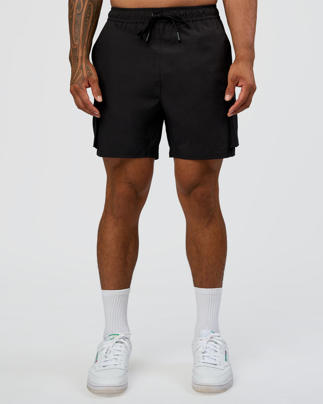 Man wearing Energy Stretch 6" Performance Cargo Short - Black | Model:Daarian | Size:M - view 7