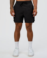 Man wearing Energy Stretch 6" Performance Cargo Short - Black | Model:Daarian | Size:M | Thumbnail Index: 6