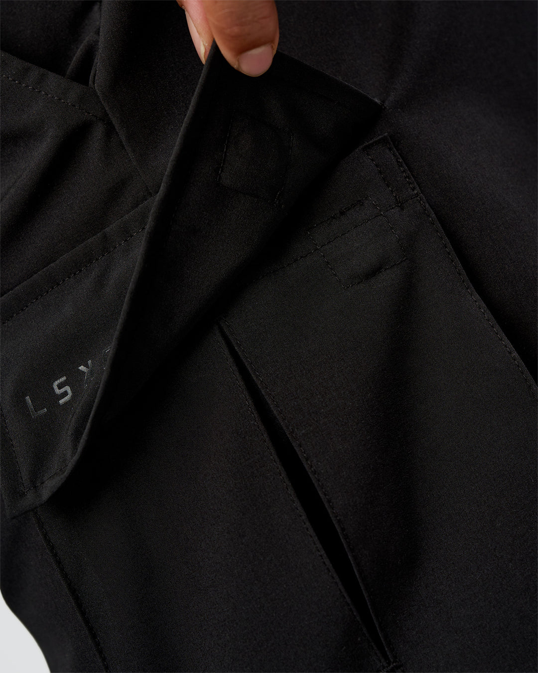 Man wearing Energy Stretch 6" Performance Cargo Short - Black | Model:Daarian | Size:M - view 2