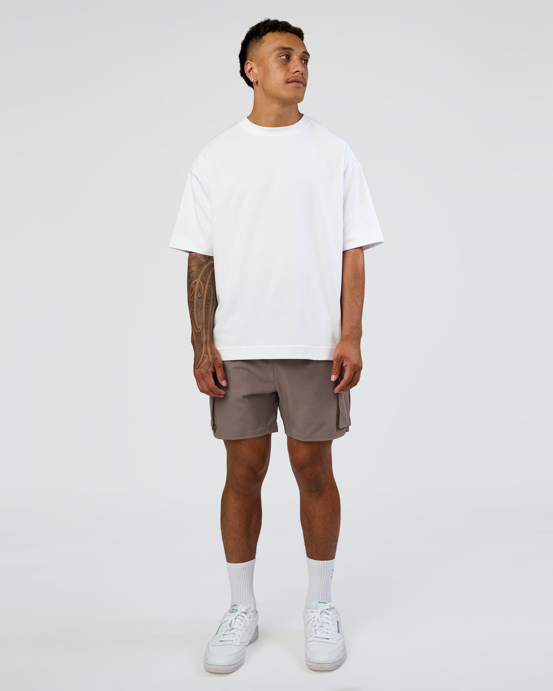 Man wearing Energy Stretch 6" Performance Cargo Short - Iron | Model:Daarian | Size:M - view 6
