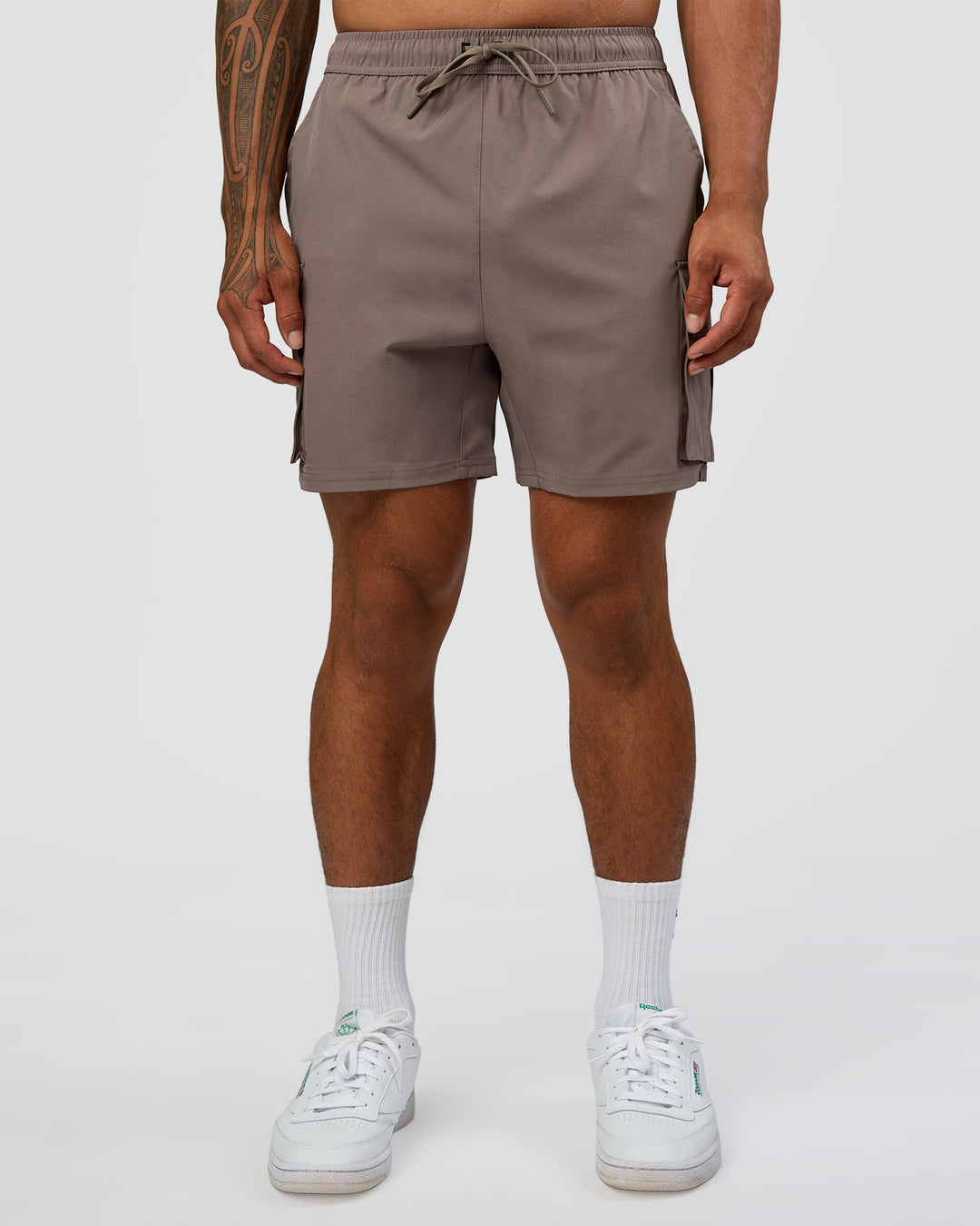 Man wearing Energy Stretch 6" Performance Cargo Short - Iron | Model:Daarian | Size:M - view 2