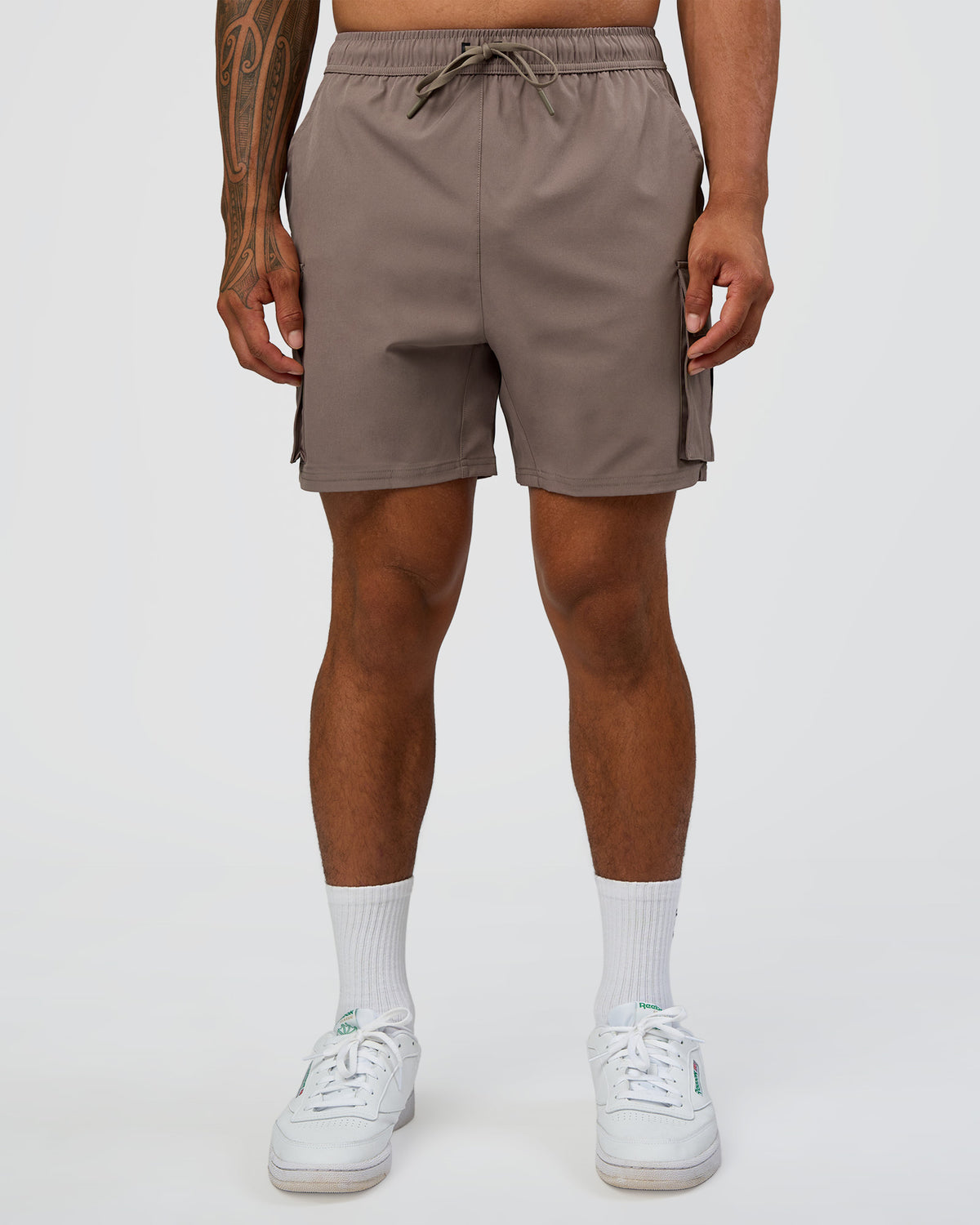 Man wearing Energy Stretch 6" Performance Cargo Short - Iron | Model:Daarian | Size:M