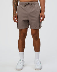 Man wearing Energy Stretch 6" Performance Cargo Short - Iron | Model:Daarian | Size:M | Thumbnail Index: 1