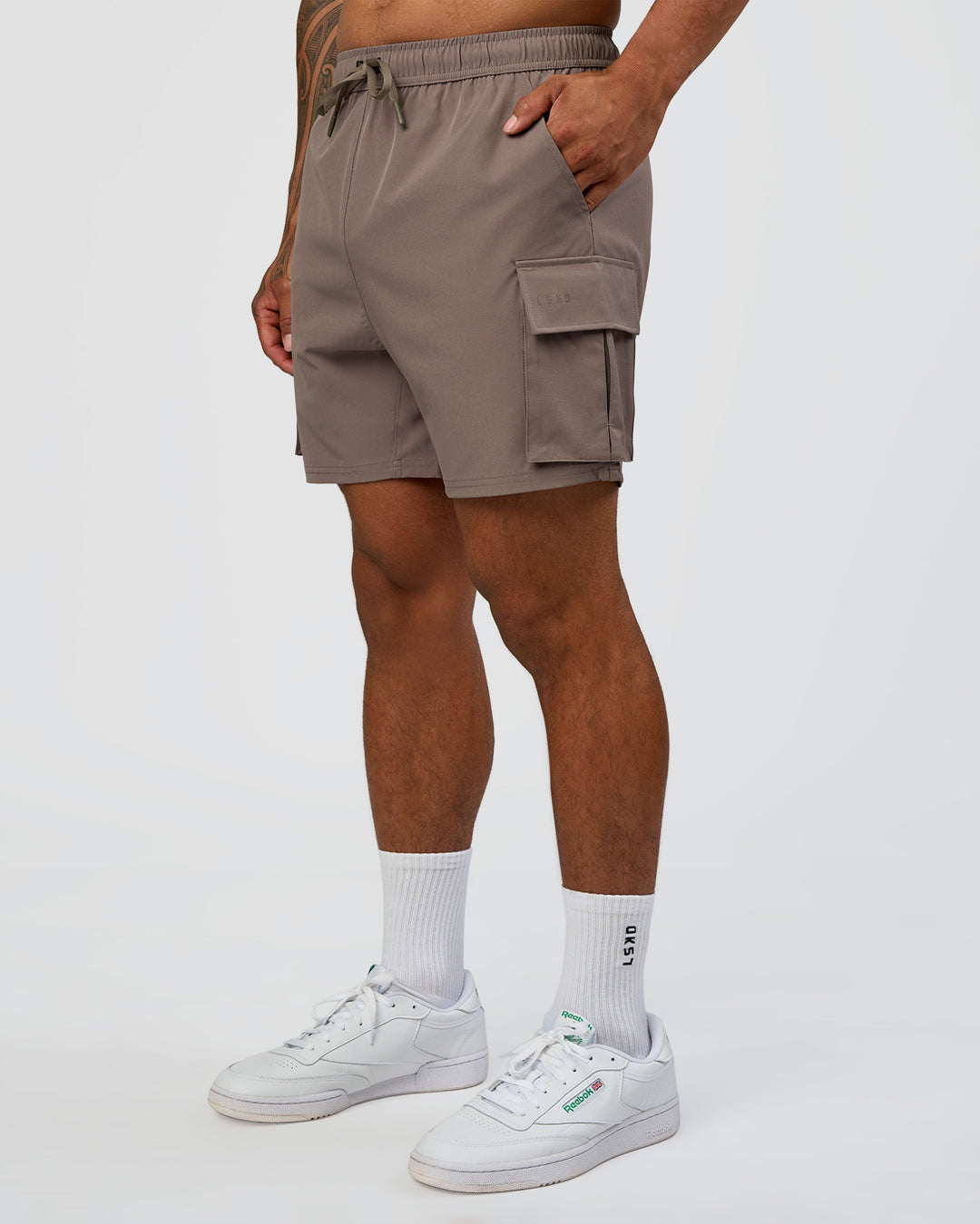 Man wearing Energy Stretch 6" Performance Cargo Short - Iron | Model:Daarian | Size:M - view 7