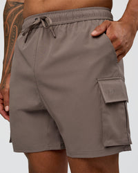 Man wearing Energy Stretch 6" Performance Cargo Short - Iron | Model:Daarian | Size:M | Thumbnail Index: 0