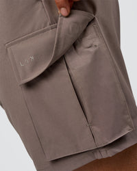 Man wearing Energy Stretch 6" Performance Cargo Short - Iron | Model:Daarian | Size:M | Thumbnail Index: 4
