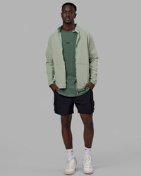 Man wearing Energy Stretch Performance Jacket - Iceberg Green | Thumbnail Index: 0