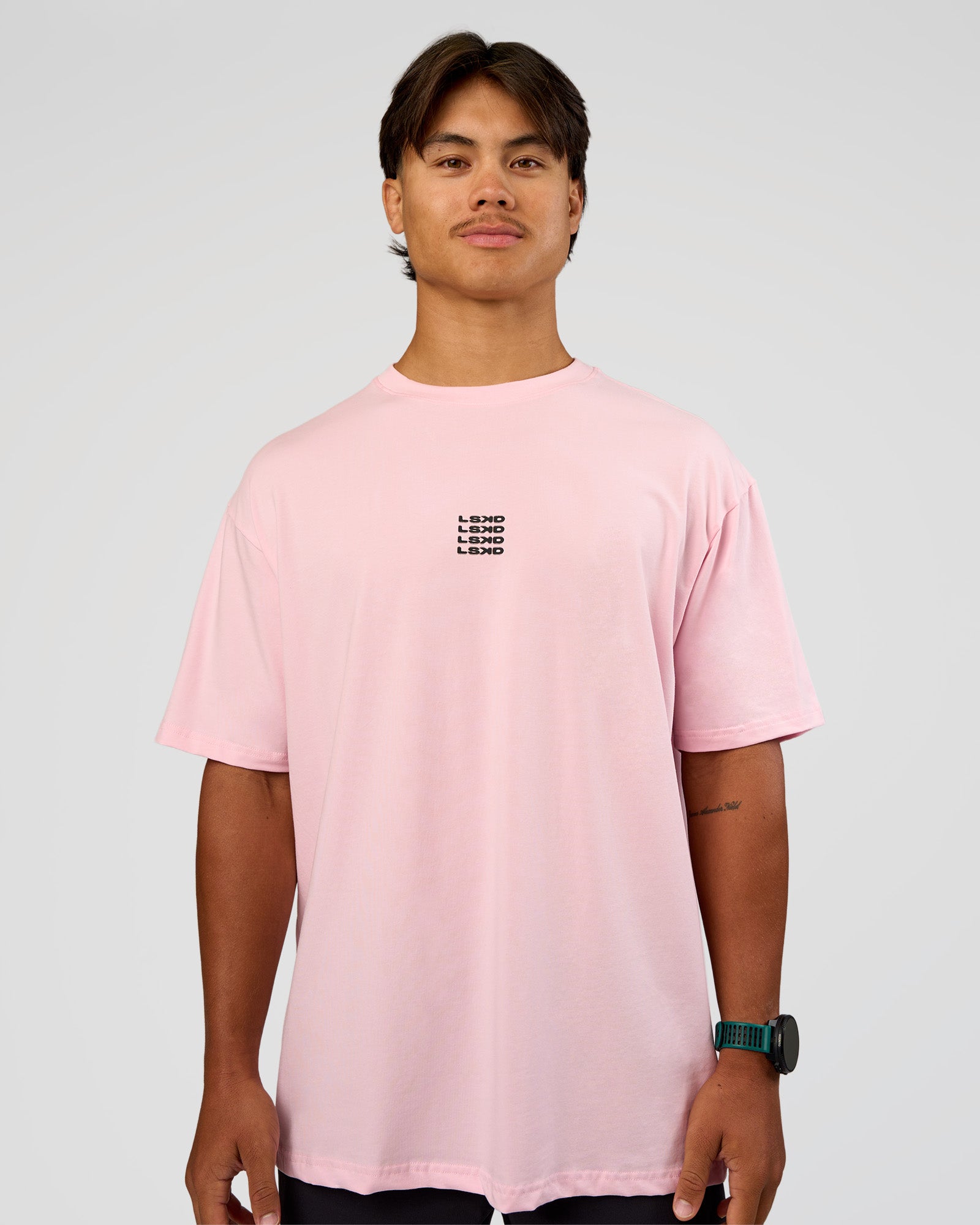 Man wearing Everyday Elevation FLXCotton Oversized Tee - Marshmallow-Black | Model:George | Size:M
