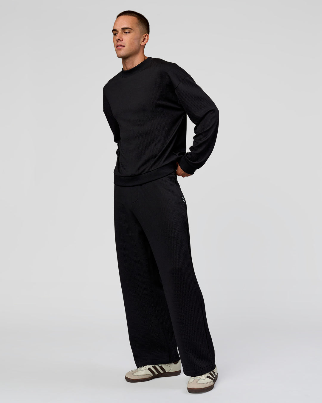 Man wearing Everyday Elevation Waffle Wide Leg Pant - Black | Model:Albert | Size:M - view 11