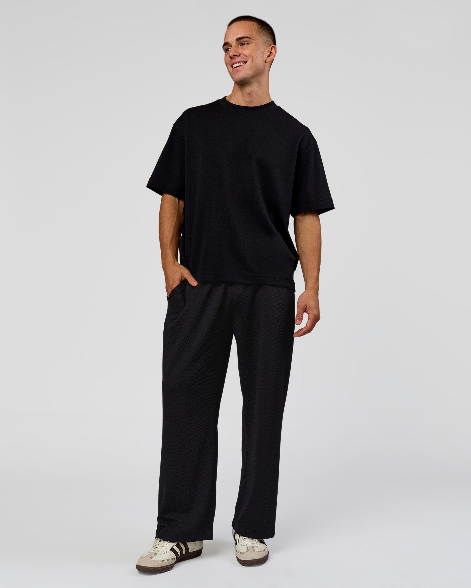 Man wearing Everyday Elevation Waffle Wide Leg Pant - Black | Model:Albert | Size:M