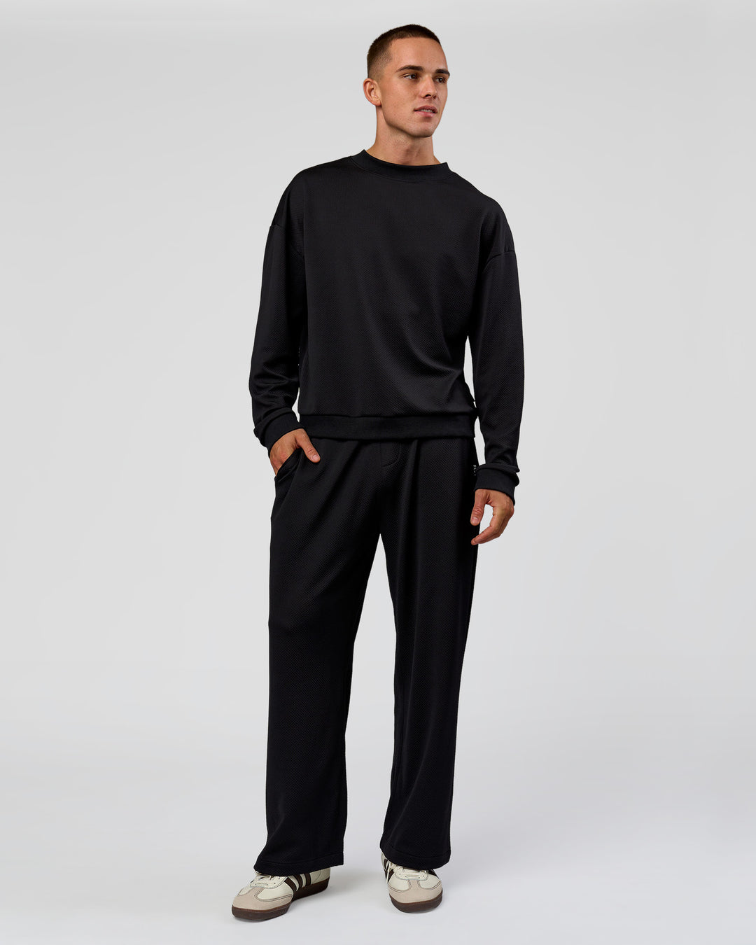 Man wearing Everyday Elevation Waffle Wide Leg Pant - Black | Model:Albert | Size:M - view 9