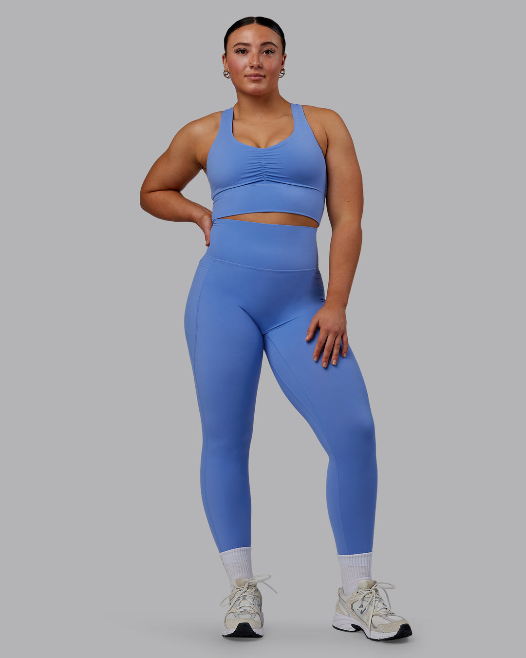 Woman wearing Evoke Sports Bra - Ultramarine - view 3
