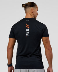 Man wearing Fitstop AeroFLX+ Seamless Tee - Black | Model:Jaiden | Size:M | Thumbnail Index: 2