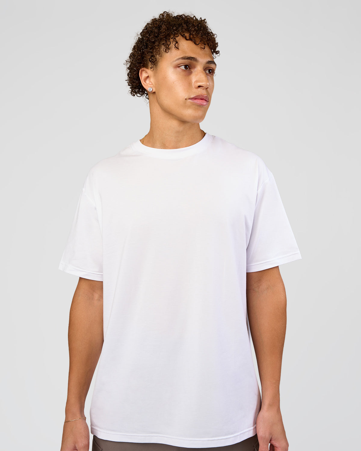 Man wearing Forever EffortlessTech Tee - White | Model:Leandro | Size:M