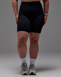 Woman wearing Fusion Ultra High-Rise 9" Short Pockets - Black | Model:Caity | Size:M | Thumbnail Index: 24